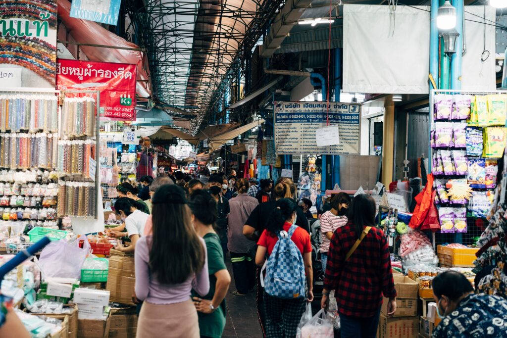 Crowded alley at Sampeng Market (Sampheng), Bangkok's vibrant Chinatown, Thailand, filled with shoppers and stalls selling accessories and wholesale goods